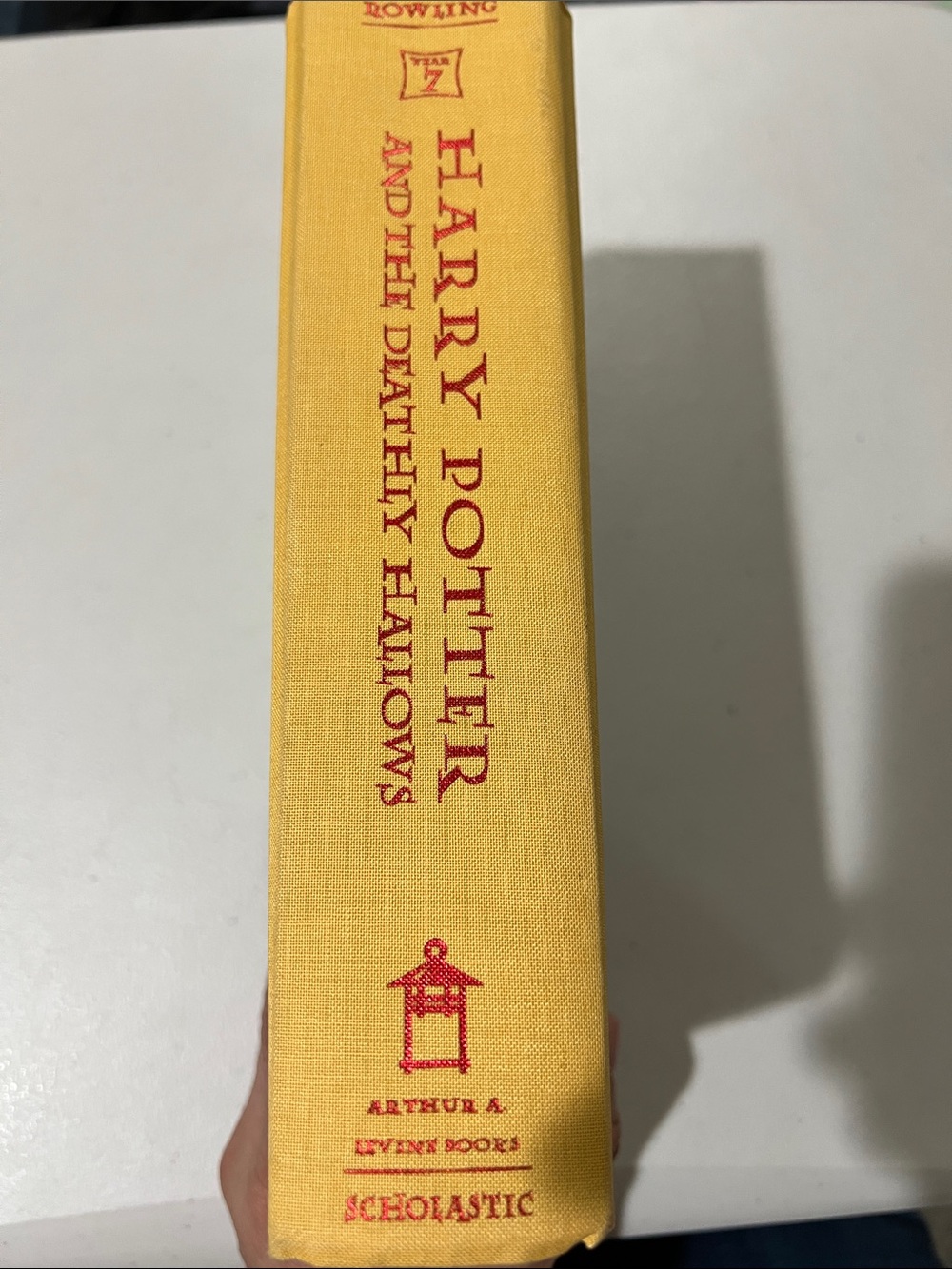 Scholastic Yellow Hardcover with Red Spine Text